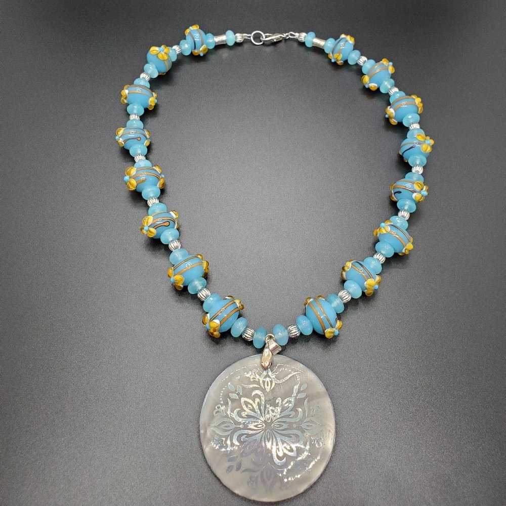 One-of-a-kind, blue and yellow hand-made glass and silver set.